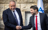 Incoming finance minister Bezalel Smotrich with outgoing finance minister Avigdor Liberman, at the official handover ceremony on January 1, 2023 (Courtesy Yonatan Sindel/Flash90)