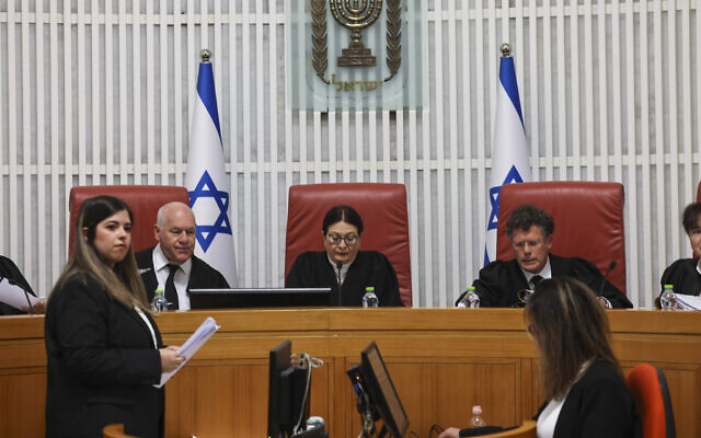 Supreme Court Chief of Justice Ester Hayut (C) attends a hearing on petitions demanding the annulment of the appointment of Shas leader Aryeh Deri as a government minister due to his recent conviction on tax offenses at the Supreme Court in Jerusalem, on January 05, 2023 (Yonatan Sindel/Flash90)