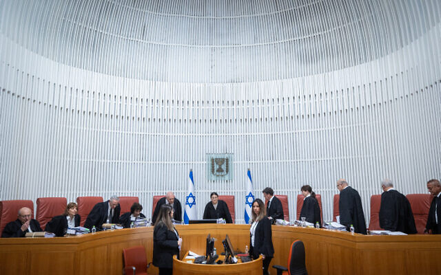 Supreme Court justices arrive for a hearing over the legality of Shas leader Aryeh Deri's appointment as a minister, at the Supreme Court in Jerusalem on January 5, 2023. (Yonatan Sindel/Flash90)