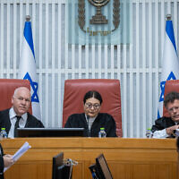 Supreme Court President Esther Hayut and other justices at a hearing of the High Court of Justice on petitions against the appointment of Shas party leader Aryeh Deri as a minister due to his recent conviction for tax offenses, January 5, 2023. (Yonatan Sindel/Flash90)