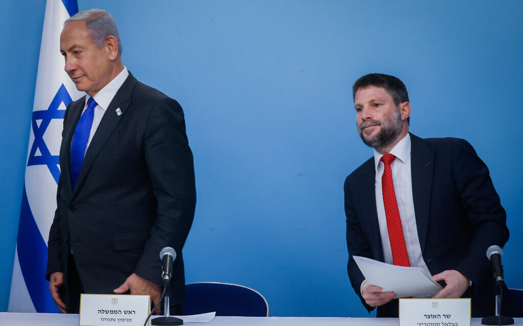 Prime Minister Benjamin Netanyahu (L) and Finance Minister Bezalel Smotrich at the Prime Minister's Office in Jerusalem, January 11, 2023. (Olivier Fitoussi/Flash90)
