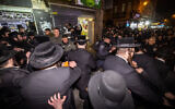Police clash with ultra-Orthodox Jews protesting against a cellphone shop in Jerusalem's Geula neighborhood on January 16, 2023. (Yonatan Sindel/Flash90)