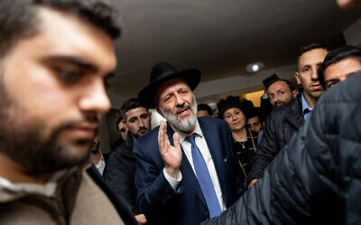 Aryeh Deri seen outside his home in Jerusalem on January 18, 2023, hours after the High Court ruled he cannot serve as a government minister.  (Yonatan Sindel/Flash90)