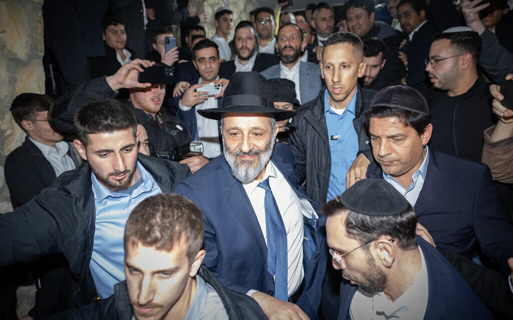 Shas leader Aryeh Deri, the Minister of Interior and Health, with supporters outside his home in Jerusalem on January 18, 2023, hours after the High Court said he cannot hold ministerial office. (Yonatan Sindel/Flash90)
