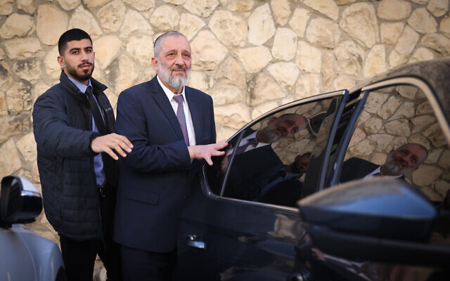 Shas chair Aryeh Deri seen outside his home in Jerusalem on January 22, 2023.  (Yonatan Sindel/Flash90)