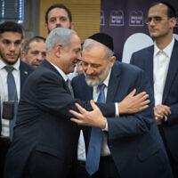 Shas leader MK Aryeh Deri and Prime Minister Benjamin Netanyahu at a Shas faction meeting in Knesset, January 23, 2023. (Yonatan Sindel/Flash90)