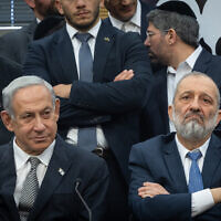 Shas leader MK Aryeh Deri and Prime Minister Benjamin Netanyahu seen during a Shas party meeting, at the Knesset, on January 23, 2023. (Yonatan Sindel/Flash90)