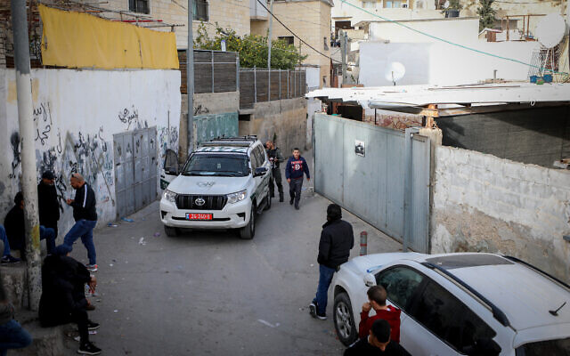 Police outside the home of the Palestinian terrorist who killed seven people in a terror attack, in Jerusalem's A-Tur neighborhood, January 28, 2023. (Jamal Awad/Flash90)