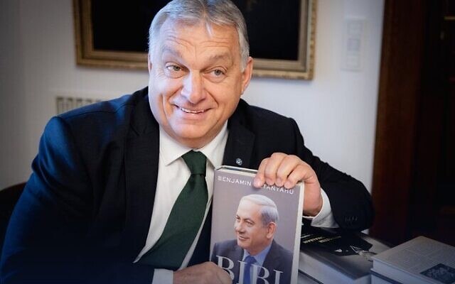 Hungarian Prime Minister Viktor Orban holds a copy of Prime Minister Benjamin Netanyahu's memoir on November 3, 2022. (Viktor Orban/Twitter)