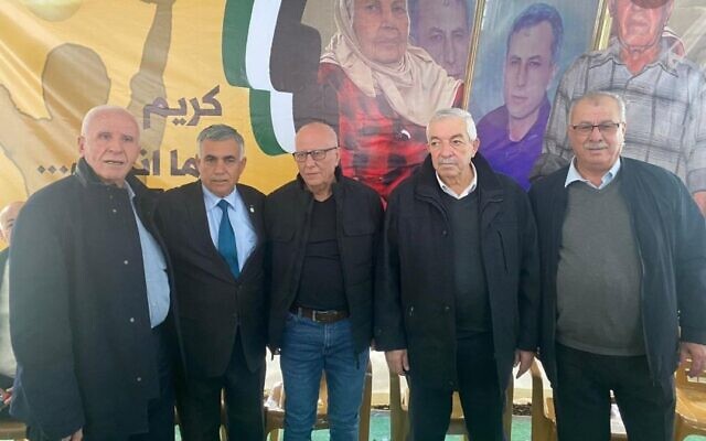 Fatah officials Azzam al-Ahmad (left), Mahmoud Aloul (2nd from right), stand next to Karim Younis (center) in the village of 'Ara in northern Israel, January 7, 2023. (Social media; used in accordance with Clause 27a of the Copyright Law)