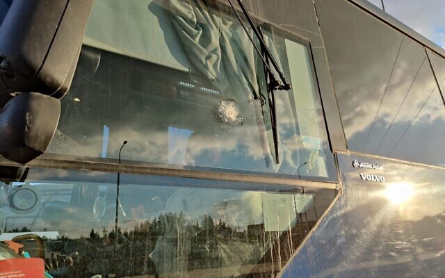 A bus damaged by gunfire along Route 60 near the West Bank town of Halhul on January 15, 2023. (Courtesy)