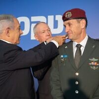 Prime Minister Benjamin Netanyahu and Defense Minister Yoav Gallant award incoming IDF chief Herzi Halevi with the rank of lieutenant general at the Prime Minister's Office in Jerusalem, January 16, 2023. (Israel Defense Forces)