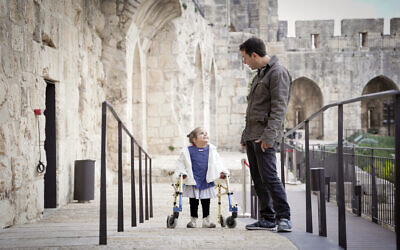 Five-year-old Geffen Kan Tor explores the newly renovated Tower of David Museum in December 2022 with her father (Courtesy Ricky Rachman)
