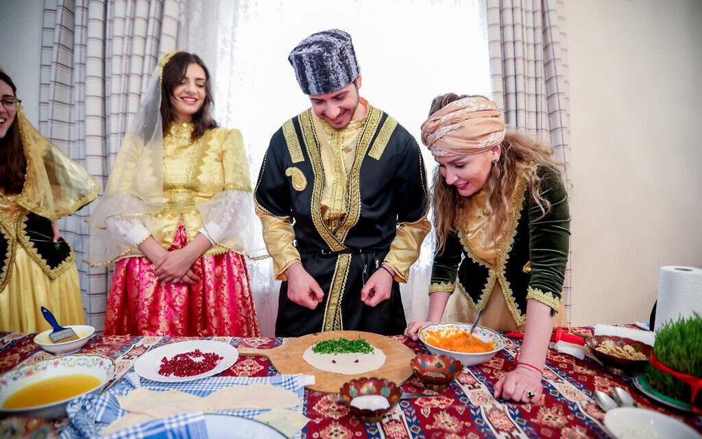 George Deek and his wife Anna, center left, learn to cook traditional Azerbaijani food during the holiday of Novruz, in Baku, March 2021. (Courtesy)
