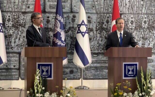President Isaac Herzog (R) accepts the credentials from new Turkish Ambassador to Israel Sakir Ozkan Torunlar in Jerusalem on January 11, 2023 (Lazar Berman/Times of Israel)