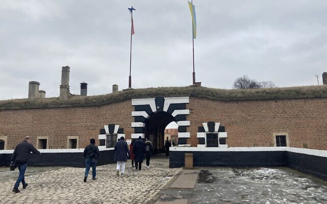 European Jewish Association delegates enter the former Theresienstadt ghetto and concentration camp, January 24, 2023. (Yaakov Schwartz/ Times of Israel)