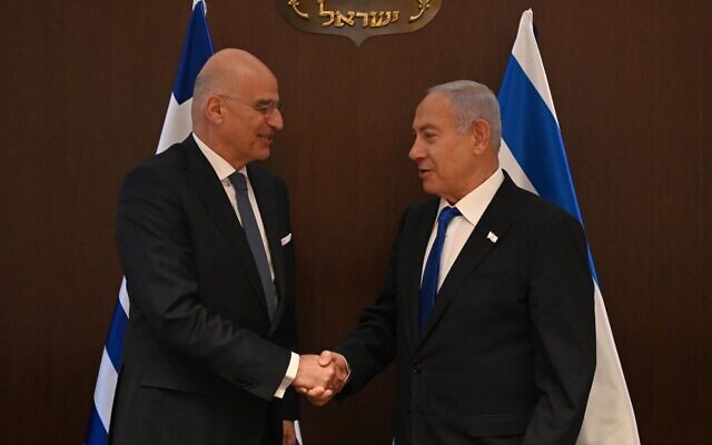 In this handout photo, Prime Minister Benjamin Netanyahu meets with Greek Foreign Minister (L) at the Prime Minister's Office in Jerusalem on January 31, 2023. (Haim Zach/GPO)