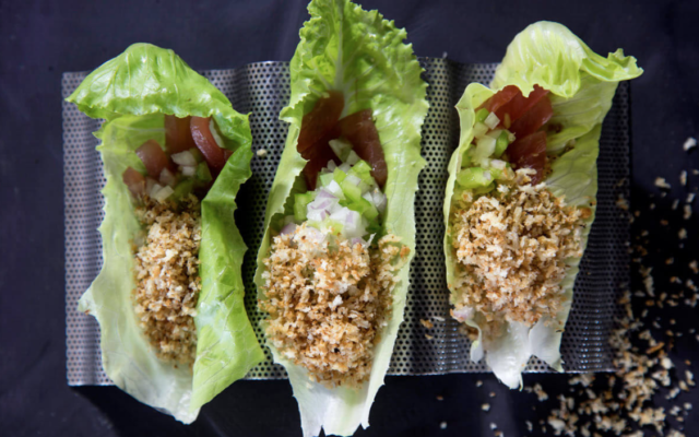 A crunchy bite of yellowfin tuna scooped into a crisp lettuce leaf is one of the appetizers at Ashdod's Pescado, winner of the 2022 Israeli Kitchen award for Best Kosher Restaurant (Courtesy Pescado)