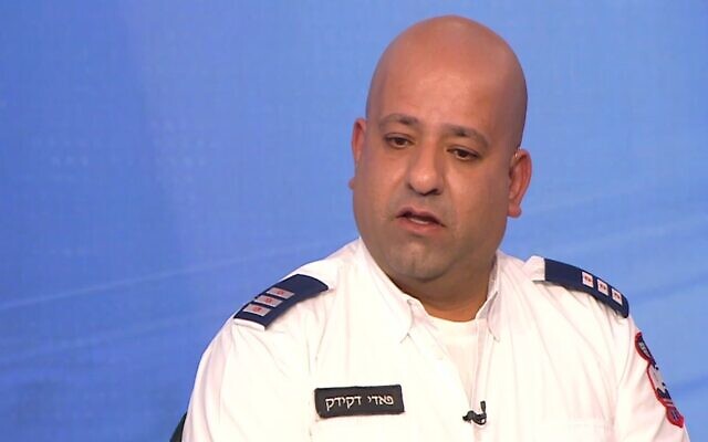 Fadi Dekidek, a senior medic with Magen David Adom emergency services, who was the first medic on the scene of the deadly January 27, 2023 terror attack in Nave Yaakov, Jerusalem, speaks to Channel 12 news on January 28, 2023. (Channel 12 screenshot)
