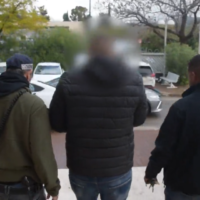 Police arrest a suspect from northern Israel who allegedly defrauded foreign investors from Arab countries out of millions, January 31, 2023. (Israel Police)