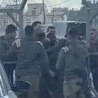 An altercation between soldiers is seen at the entrance of the Harsina military outpost, near the West Bank city of Hebron, January 30, 2023. (Screenshot:  used in accordance with Clause 27a of the Copyright Law)