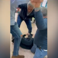 A screenshot taken from a video showing parents of a toddler assault a doctor at Soroka Medical Center in Beersheba over his refusal to expedite treatment for their son, January 16, 2023. (Twitter/Screenshot: used in accordance with Clause 27a of the Copyright Law)