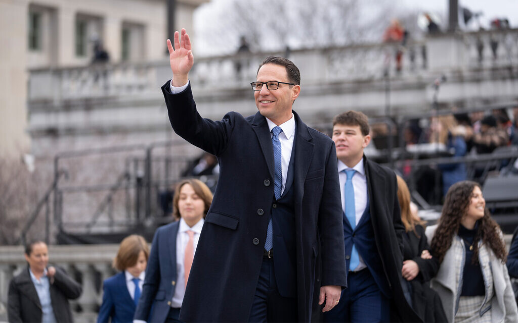 Democratic Governor Josh Shapiro waves after a ceremony to become Pennsylvania's 48th governor at the state capitol in Harrisburg, Pennsylvania, January 17, 2023. (AP Photo/Matt Rourke)