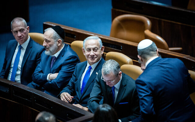 From left: Defense Minister Yoav Gallant, Interior and Health Minister Aryeh Deri, Prime Minister Benjamin Netanyahu, and Justice Minister Yariv Levin, during the swearing in ceremony of the new Israeli government at the Knesset in Jeruslaem, on December 29, 2022. (Yonatan Sindel/Flash90)