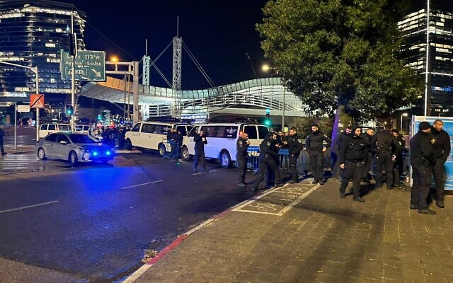 Police block off the entrance to the Ayalon Highway in Tel Aviv, during an anti-government protest, on January 14, 2023. (Naomi Lanzkron/Times of Israel)