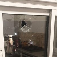 Damage to the window of a home in the West Bank settlement of Shaked is seen, following a shooting attack, January 16, 2023. (Samaria Regional Council)