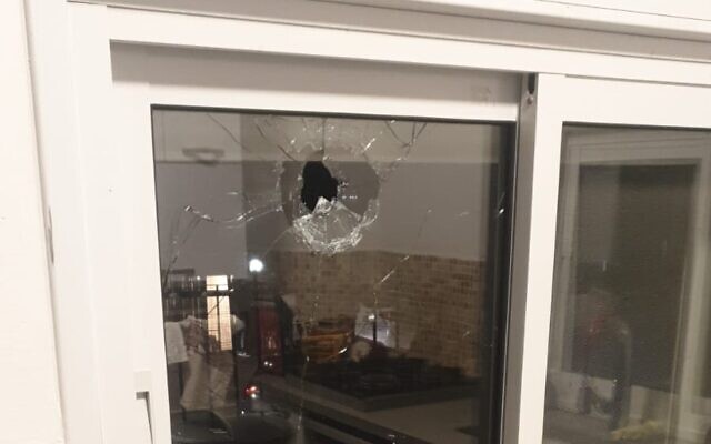 Damage to the window of a home in the West Bank settlement of Shaked is seen, following a shooting attack, January 16, 2023. (Samaria Regional Council)