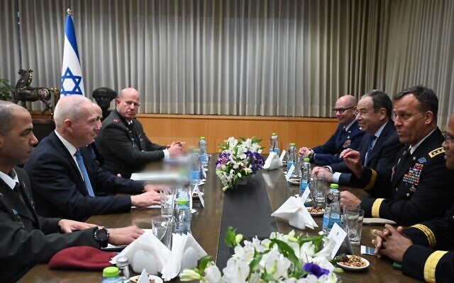 Defense Minister Yoav Gallant (2L) holds a meeting with US Central Command chief Michael Kurilla (2R), US ambassador to Israel Tom Nides, IDF defense attaché to Washington Hidai Zilberman, and Tal Kelman, who holds the military's Iran file, at the defense minister's office in Tel Aviv, January 17, 2023. (Ariel Hermoni/Defense Ministry)
