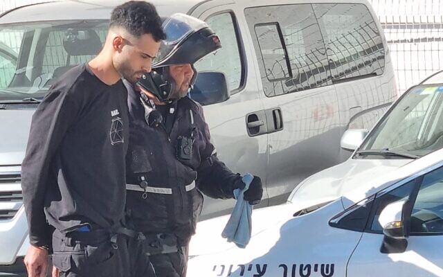 Police detain a Palestinian man illegally in Israel in the coastal city of Netanya, January 19, 2023. (Lior Damari/Courtesy)