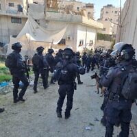 Police officers enter the Shuafat refugee camp to demolish the home of a Palestinian gunman, January 25, 2023. (Israel Police)