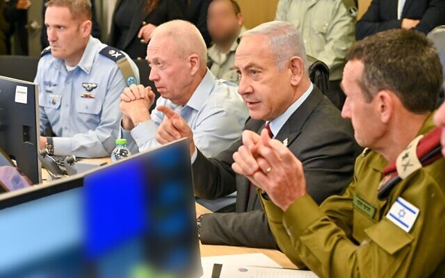From right, IDF Chief of Staff Herzi Halevi, Prime Minister Benjamin Netanyahu and Defense Minister Yoav Gallant observe a joint US, Israeli military exercise at the Air Force command center, January 25, 2023. (Kobi Gideon/GPO)