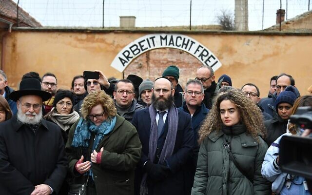 European Jewish Association delegates pose for a photo at the former Theresienstadt ghetto and concentration camp, January 24, 2023. (Yaakov Schwartz/ Times of Israel)