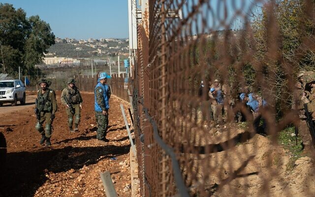 Israeli soldiers, Lebanese soldiers, and UNIFIL troops inspect IDF engineering work on the border between Israel and Lebanon, January 19, 2023. (Israel Defense Forces)
