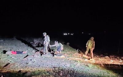 Israeli combat engineering troops extract a teenager from a minefield near Kibbutz Meitzar, January 24, 2023. (Israel Defense Forces)