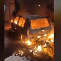 A screen capture from a video showing a car set alight by suspected Jewish settlers in the West Bank Palestinian village of Jaloud, January 29, 2023. (Twitter video screenshot: Used in accordance with Clause 27a of the Copyright Law)