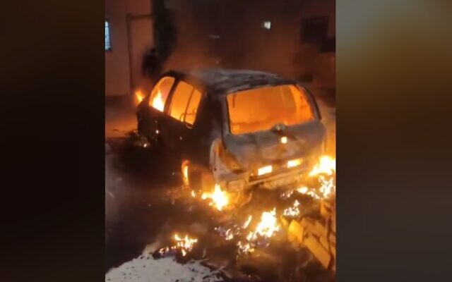 A screen capture from a video showing a car set alight by suspected Jewish settlers in the West Bank Palestinian village of Jaloud, January 29, 2023. (Twitter video screenshot: Used in accordance with Clause 27a of the Copyright Law)