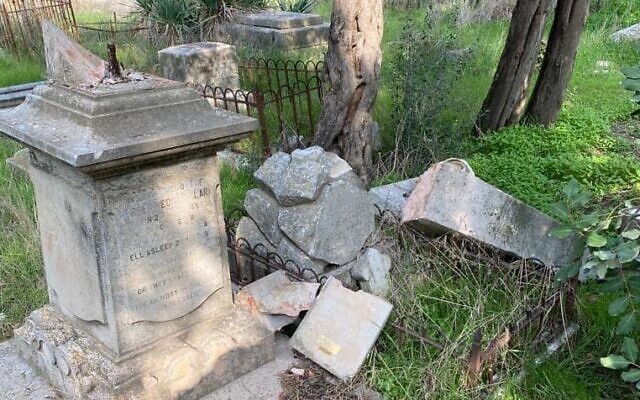 Damaged tombstones at the Protestant Mount Zion Cemetery, in Jerusalem, January 3, 2022. (Israel Police)