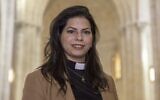 Sally Ibrahim Azar, the first female pastor in the Holy Land of the Lutheran Church, poses for a picture at the Lutheran Church in the Jerusalem's Old City, on January 25, 2023. (Photo by MENAHEM KAHANA / AFP)