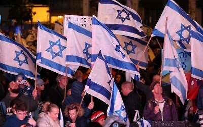 Israeli protesters attend a rally against Prime Minister Benjamin Netanyahu's new far-right government in the coastal city of Tel Aviv on February 4, 2023. (Jack Guez/AFP)