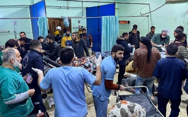 Victims are rushed to the emergency ward of the Bab al-Hawa Hospital following an earthquake, in the rebel-held northern countryside of Syria's Idlib province on the border with Turkey, February 6, 2023. (Aaref WATAD/AFP)