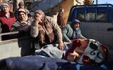 Syrian women weep next to bodies lying on the back of a truck on February 7, 2023, in the town of Jandaris, in the rebel-held part of Aleppo province, as a search operation continues following a deadly earthquake (Mohammed AL-RIFAI / AFP)