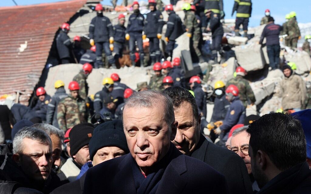 Turkish President Recep Tayyip Erdogan tours the site of destroyed buildings during his visit to the city of Kahramanmaras in southeast Turkey, two days after the severe earthquake that hit the region, on February 8, 2023. (Adem ALTAN / AFP)