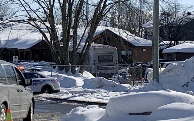 Police secure the scene where a city bus crashed into a day care center in Laval, Canada, on February 8, 2023. (Anne-Sophie THILL / AFP)