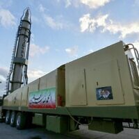 An Iranian long-range Ghadr missile with "Death to Israel" written in Hebrew down the side is displayed at a defense exhibition in city of Isfahan, central Iran, on February 8, 2023. (Morteza Salehi/Tasnim News/AFP)