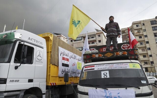 Trucks loaded with humanitarian aid provided by Lebanese Shiite terror group Hezbollah set out for Syria from Beirut's southern suburbs on February 12, 2023. (Anwar Amro/AFP)