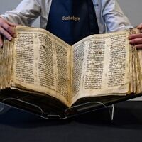 The 'Codex Sassoon' bible is displayed at Sotheby's in New York on February 15, 2023. (Ed Jones/AFP)